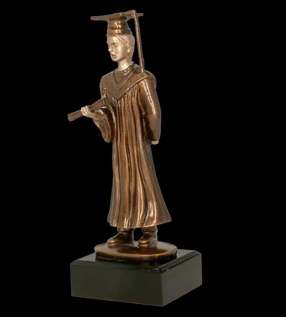 Cast figurine - graduate